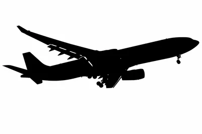 Silhouette Of A Commercial Airplane Landing