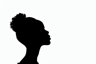 Silhouette Of A Young Woman With Curly Hair