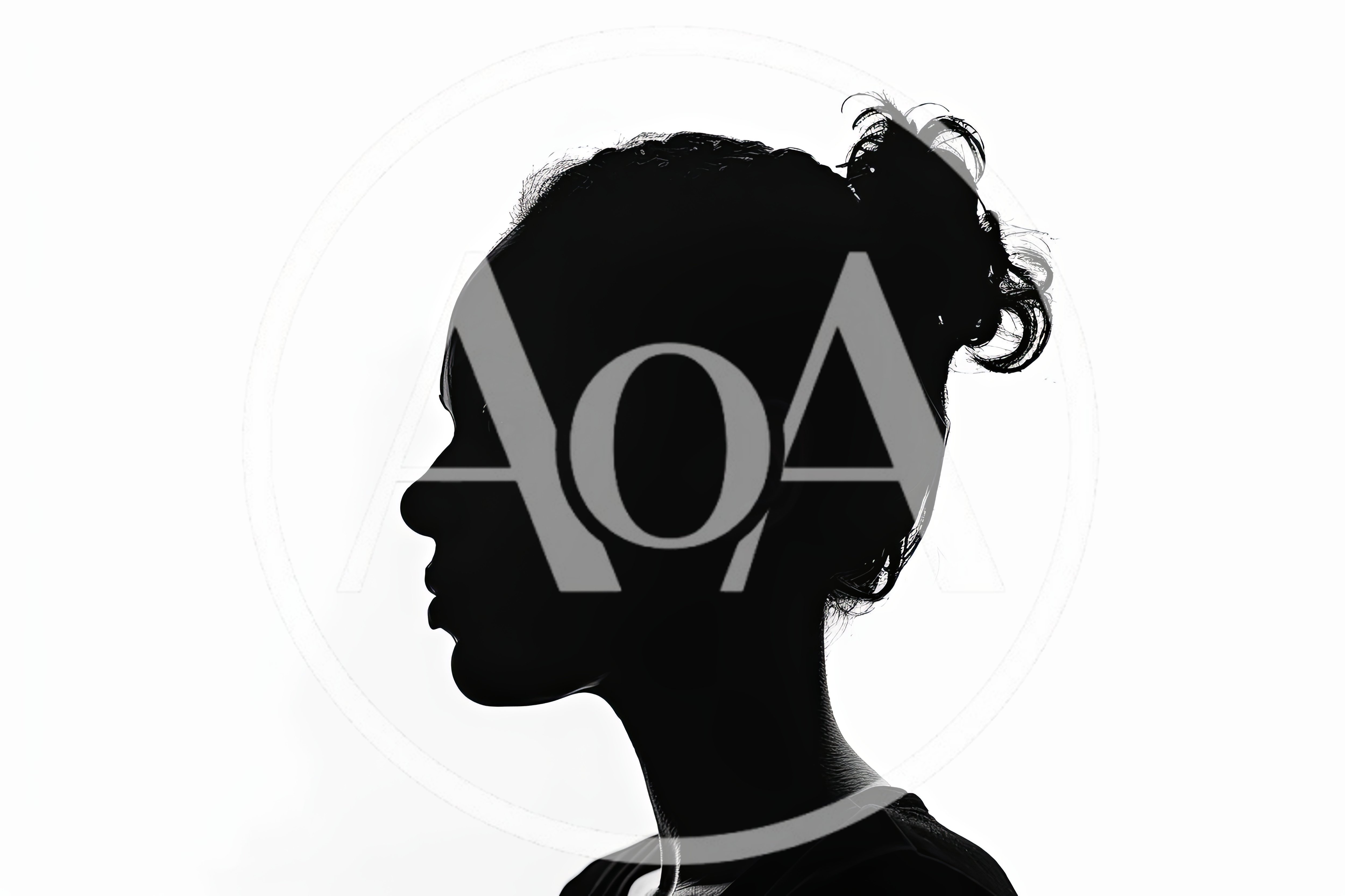 Silhouette Profile Of A Young Woman With Messy Bun