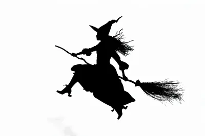 Silhouette Of A Witch Flying On A Broomstick