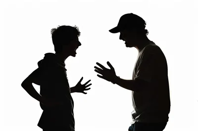 Silhouettes Of Two Men Arguing In Profile