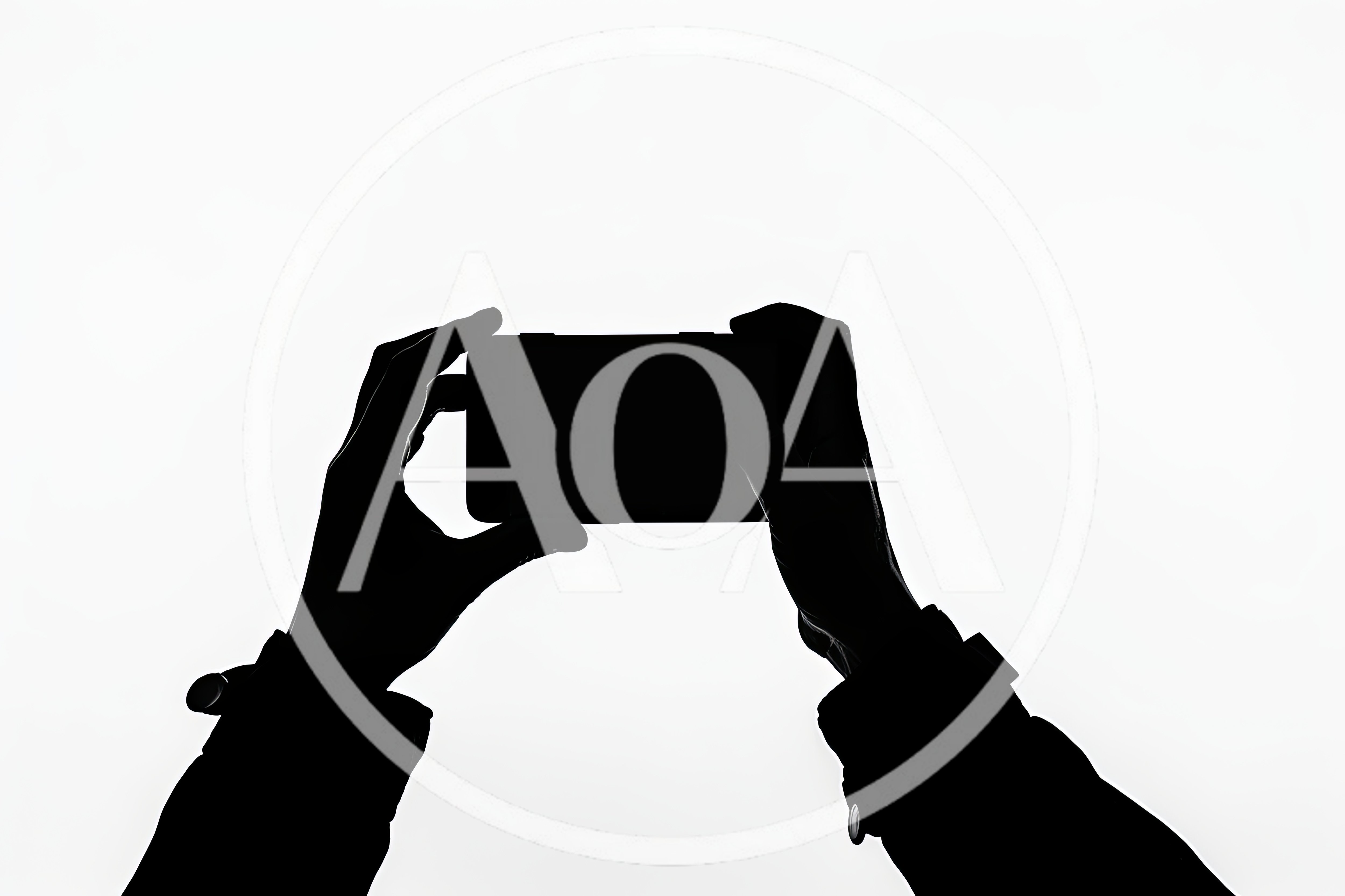 Silhouette Of Hands Holding A Smartphone