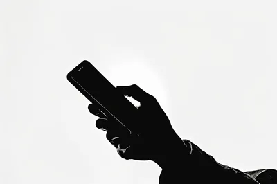 Silhouette Of A Person Holding A Smartphone