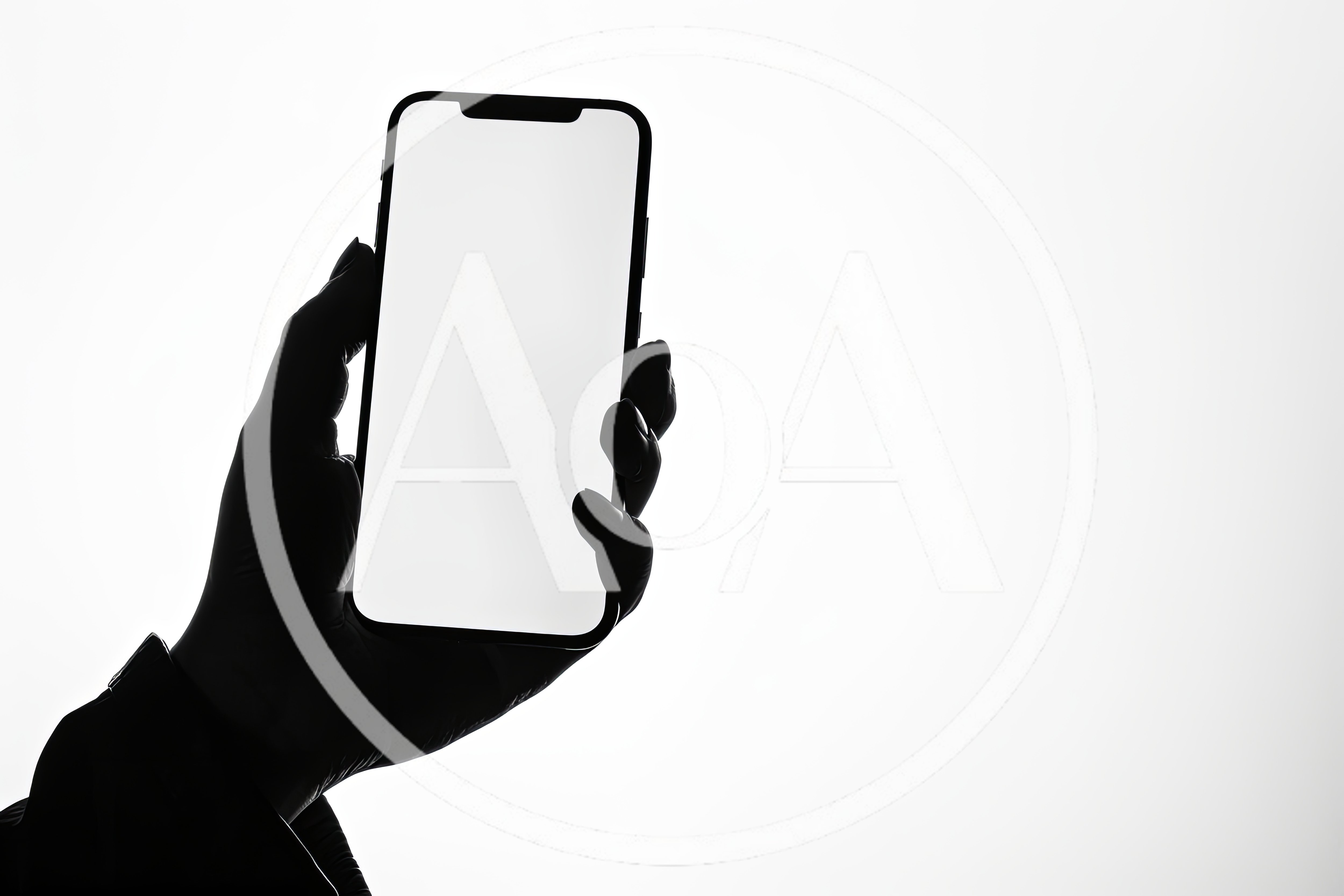 Silhouette Of A Hand Holding A Smartphone