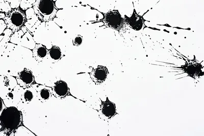 Black Ink Splatters On White Background
