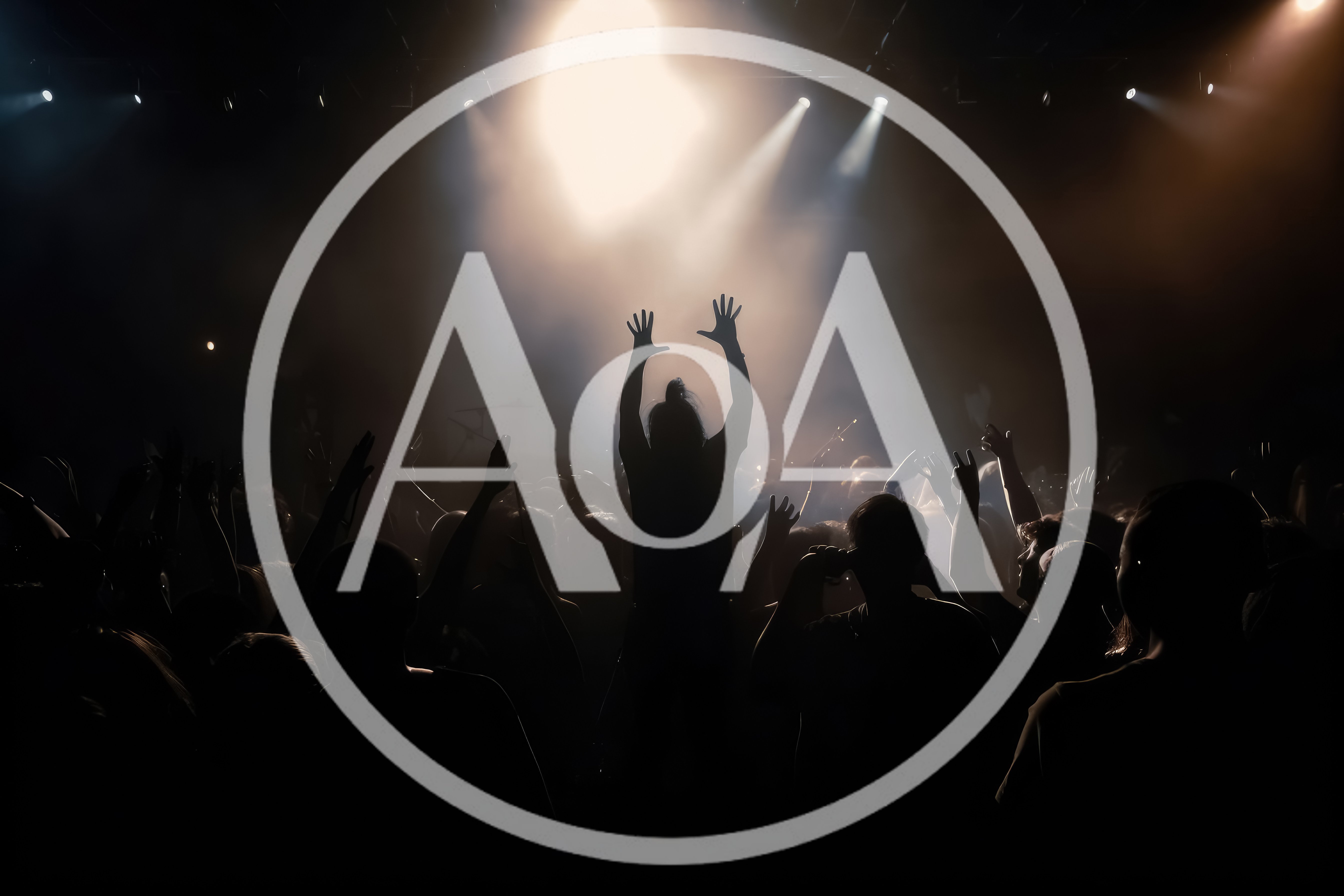 Concert Crowd With Raised Hands Under Stage Lights