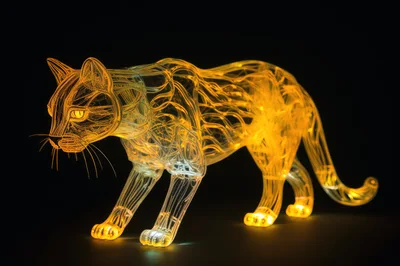 Glowing Wireframe Panther Sculpture On Black Background