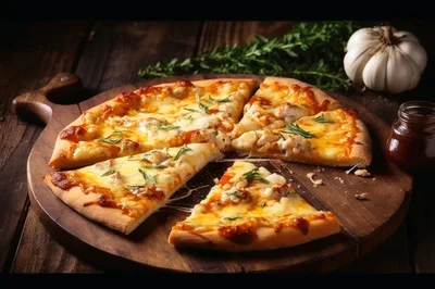 Freshly Baked Pizza Slices On A Wooden Serving Board