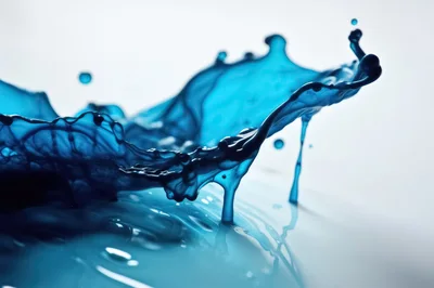 Dynamic Blue Liquid Splash On White Background