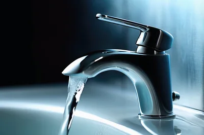 Chrome Bathroom Faucet Running Water Into Sink