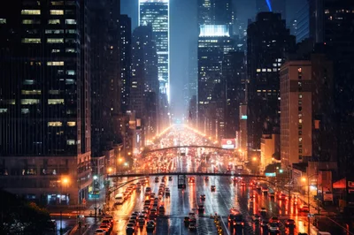 Nighttime Traffic Flow On A Rainy New York City Street