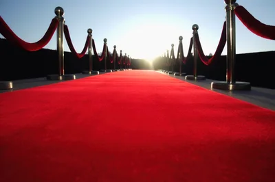 Red Carpet Entrance With Stanchions At Sunset