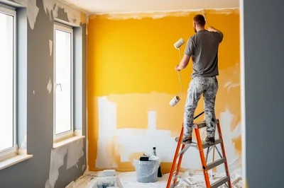 Professional Painter Painting A Wall Yellow