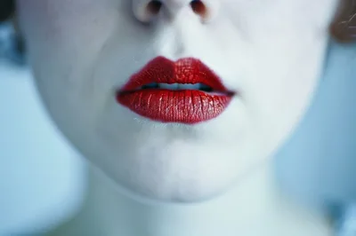 Close Up Of Woman With Vibrant Red Lipstick