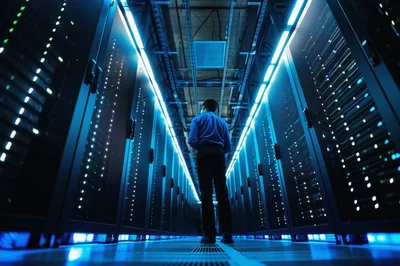 IT Technician Standing In A Modern Data Center