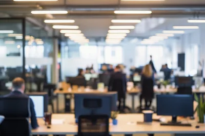 Blurred View Of Busy Modern Open Plan Office