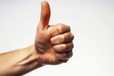 Close Up Of A Human Hand Giving Thumbs Up