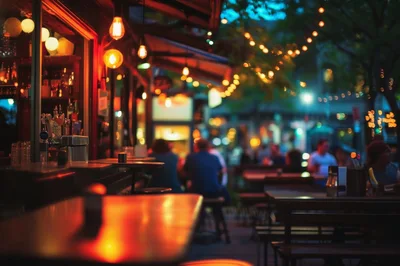 Outdoor Bar Seating At Night With String Lights
