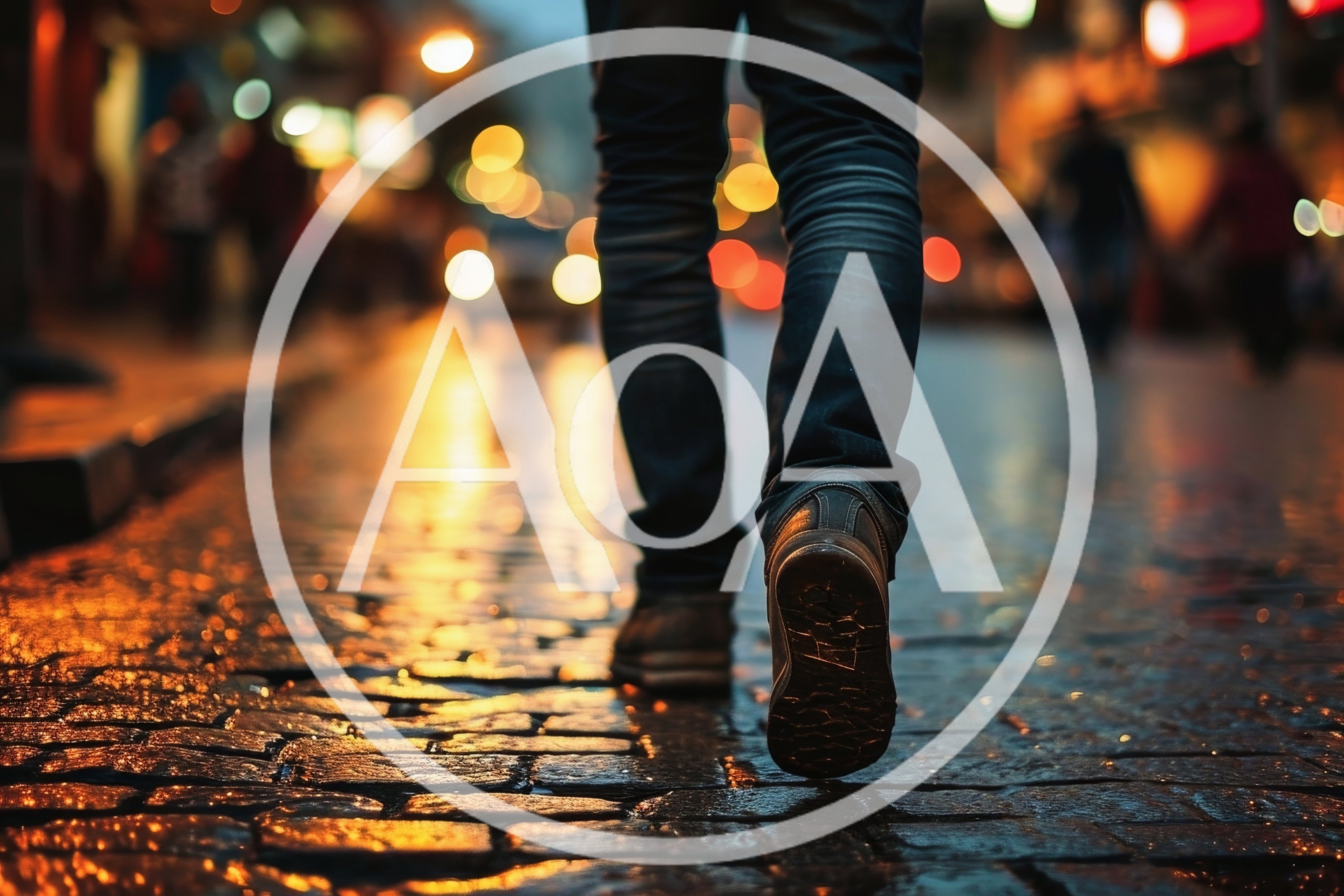 Person Walking On Wet Cobblestone Street At Night