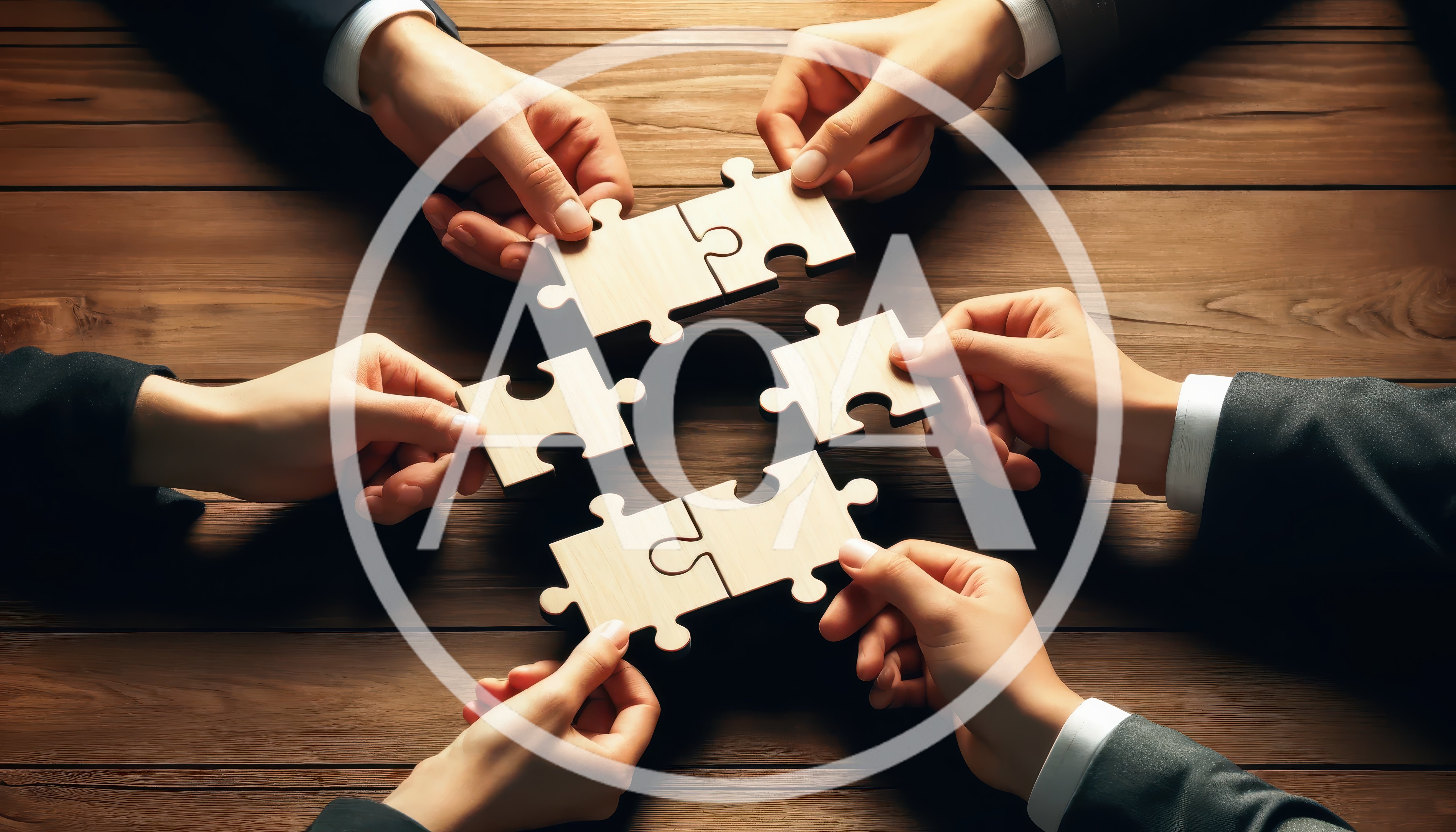 Business Team Connecting Puzzle Pieces On Wooden Table
