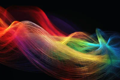 Abstract Rainbow Light Trails Flowing On Black Background