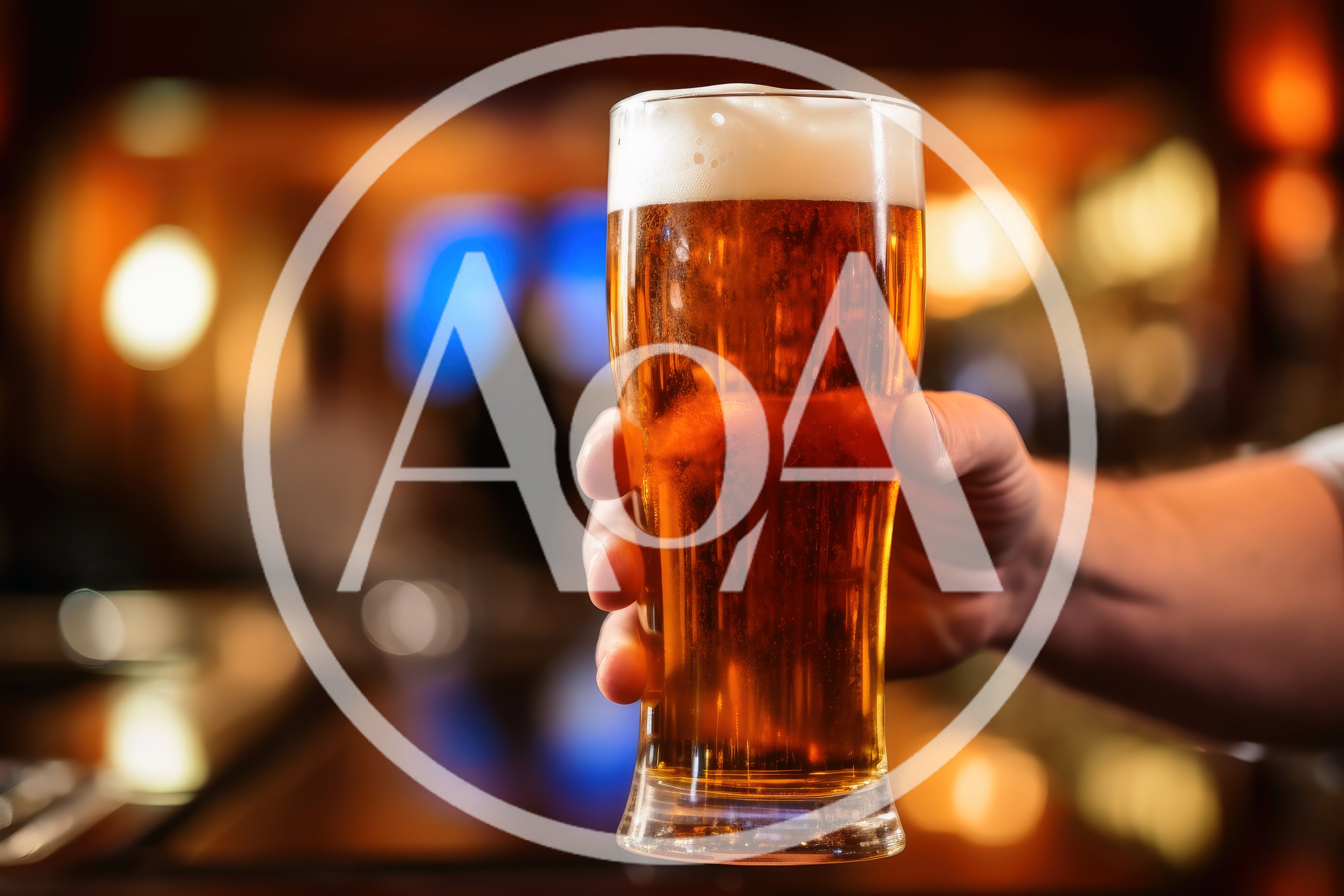 Hand Holding A Glass Of Cold Beer In A Bar