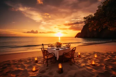 Romantic Beachside Dinner Table Setup At Sunset