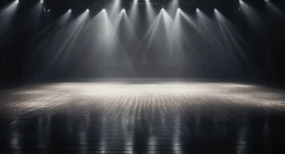 Empty Stage With Dramatic Overhead Spotlight Beams