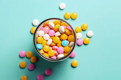 Glass Jar Filled With Assorted Colorful Medical Pills