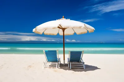 Two Beach Chairs Under Umbrella On Tropical Shore