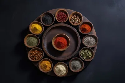 Assorted Spices In Wooden Bowls On A Circular Tray