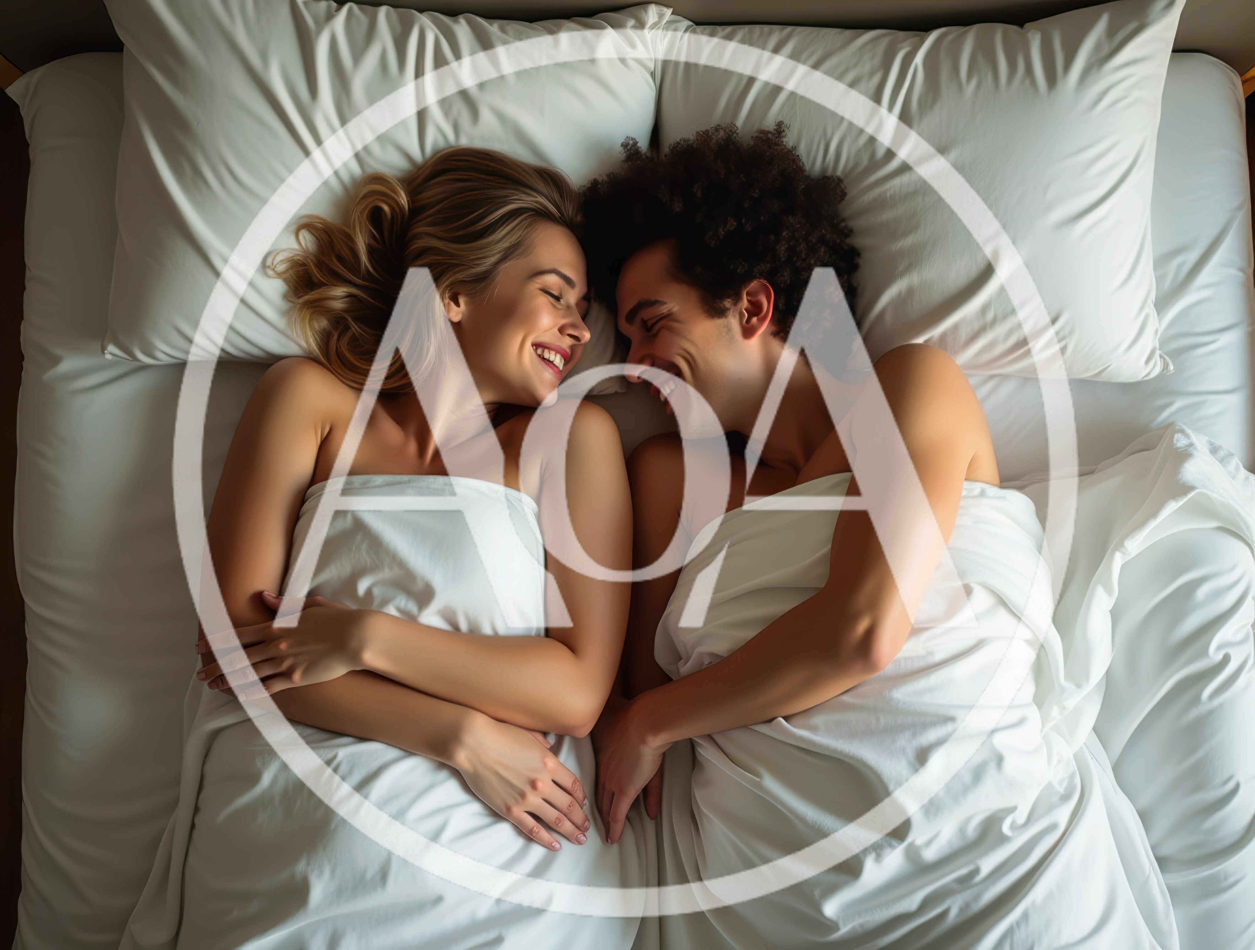 Happy Couple Lying Together In Bed