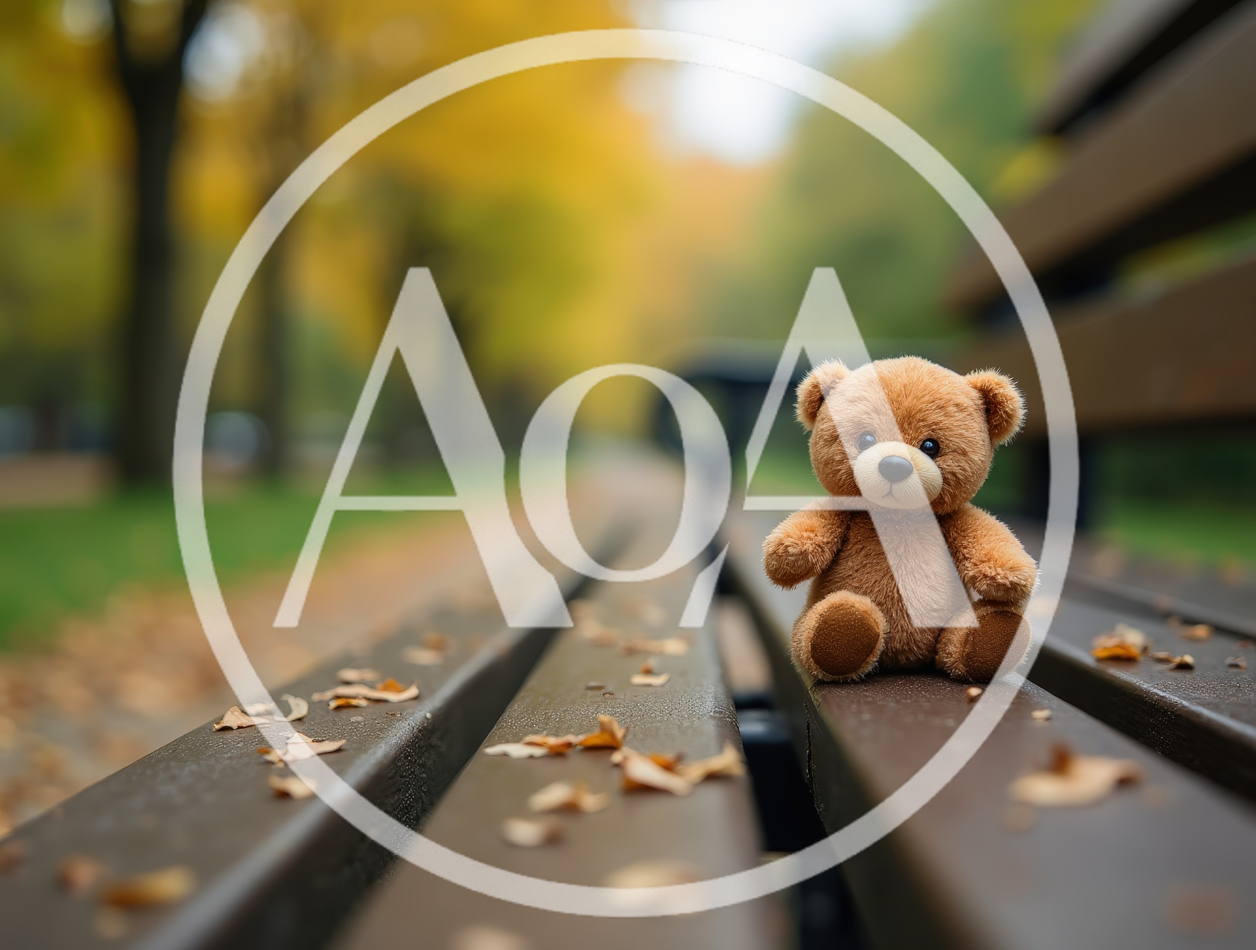 Small Teddy Bear Sitting On A Park Bench