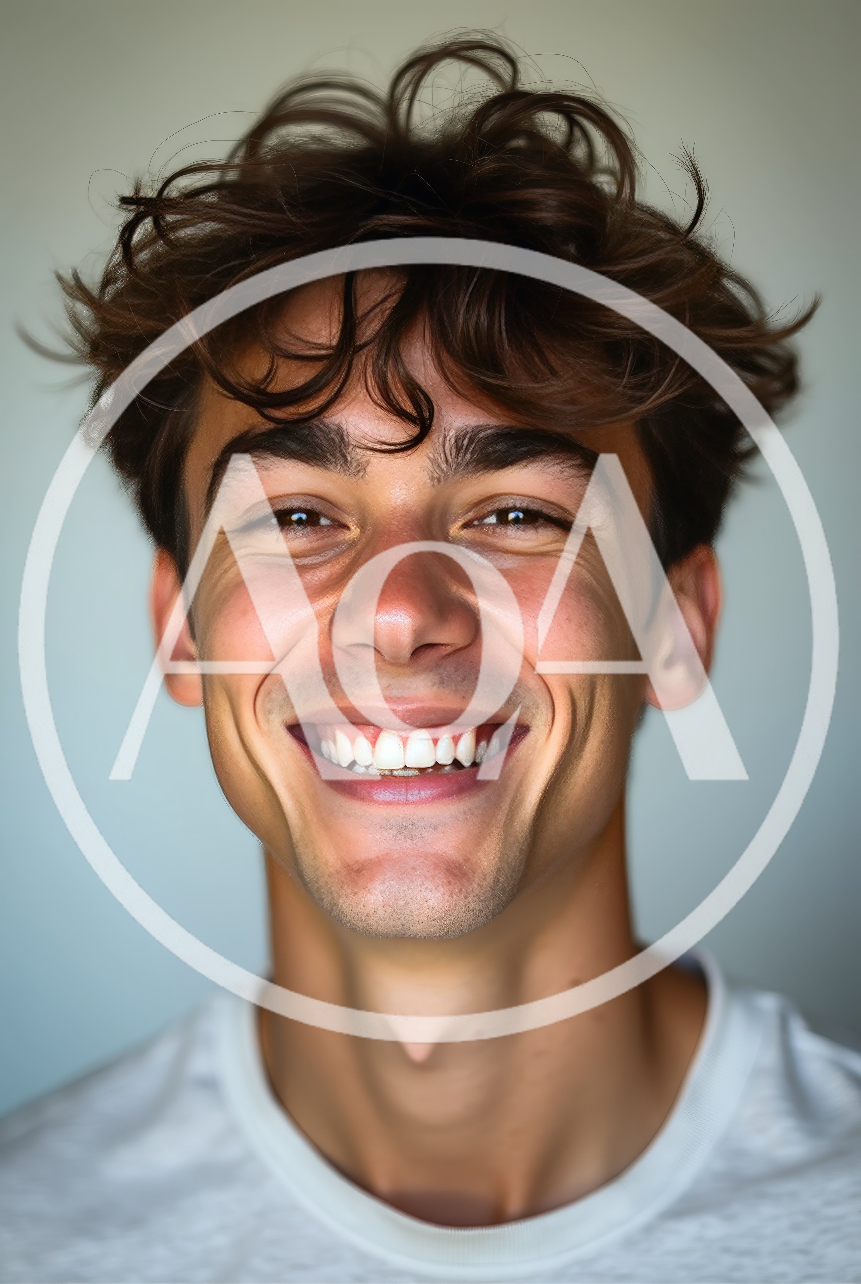 Portrait Of A Smiling Young Man With Messy Hair