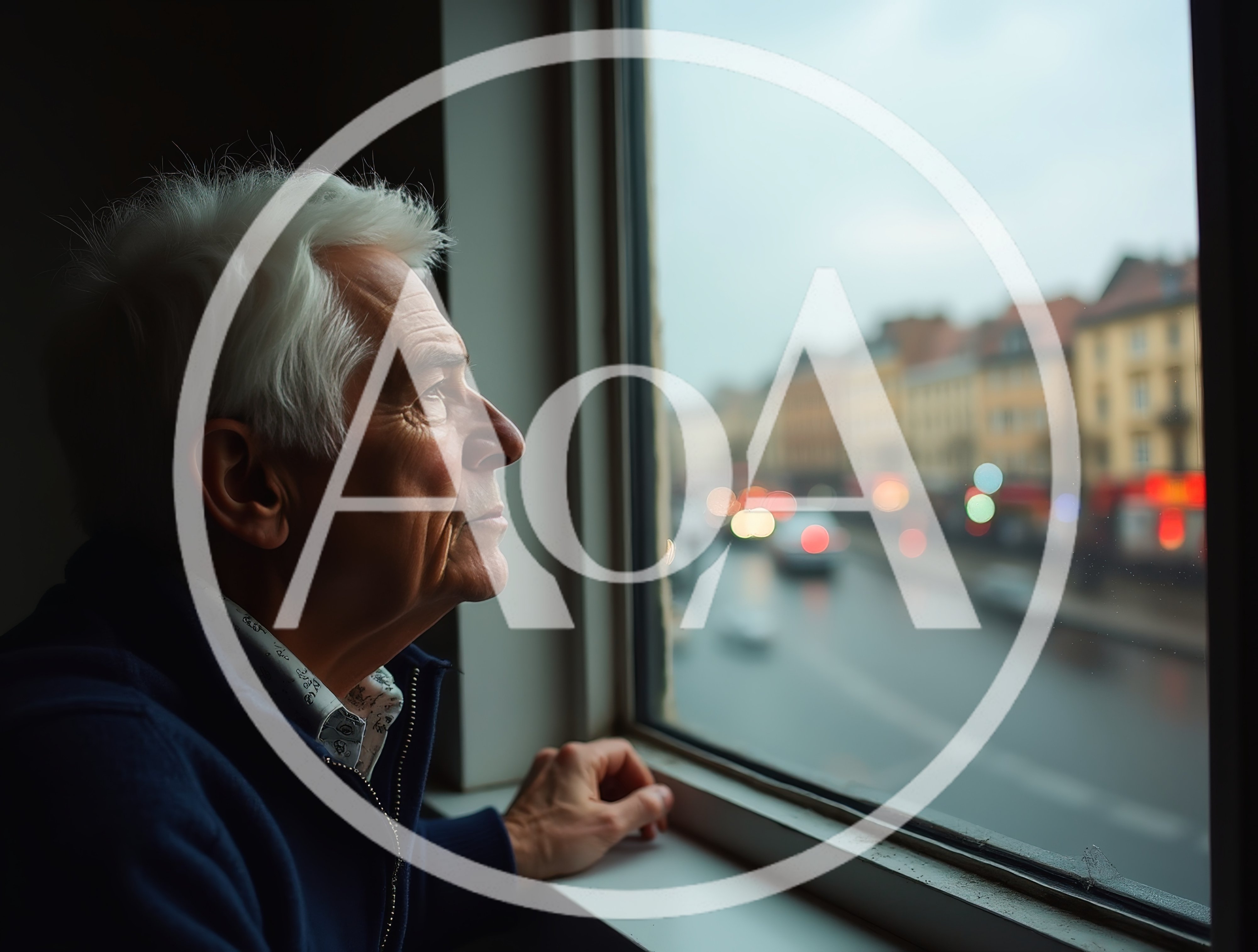 Elderly Man Looking Out Of A Window