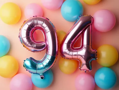 Number 94 Foil Balloons on Pastel Background