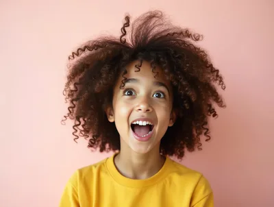 Excited Young Girl With Curly Hair