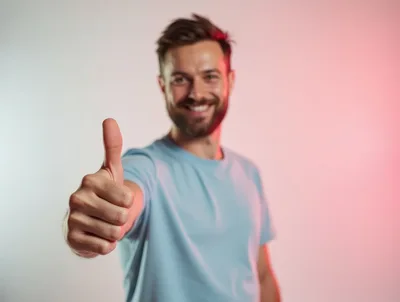 Smiling Man Giving A Thumbs Up Gesture