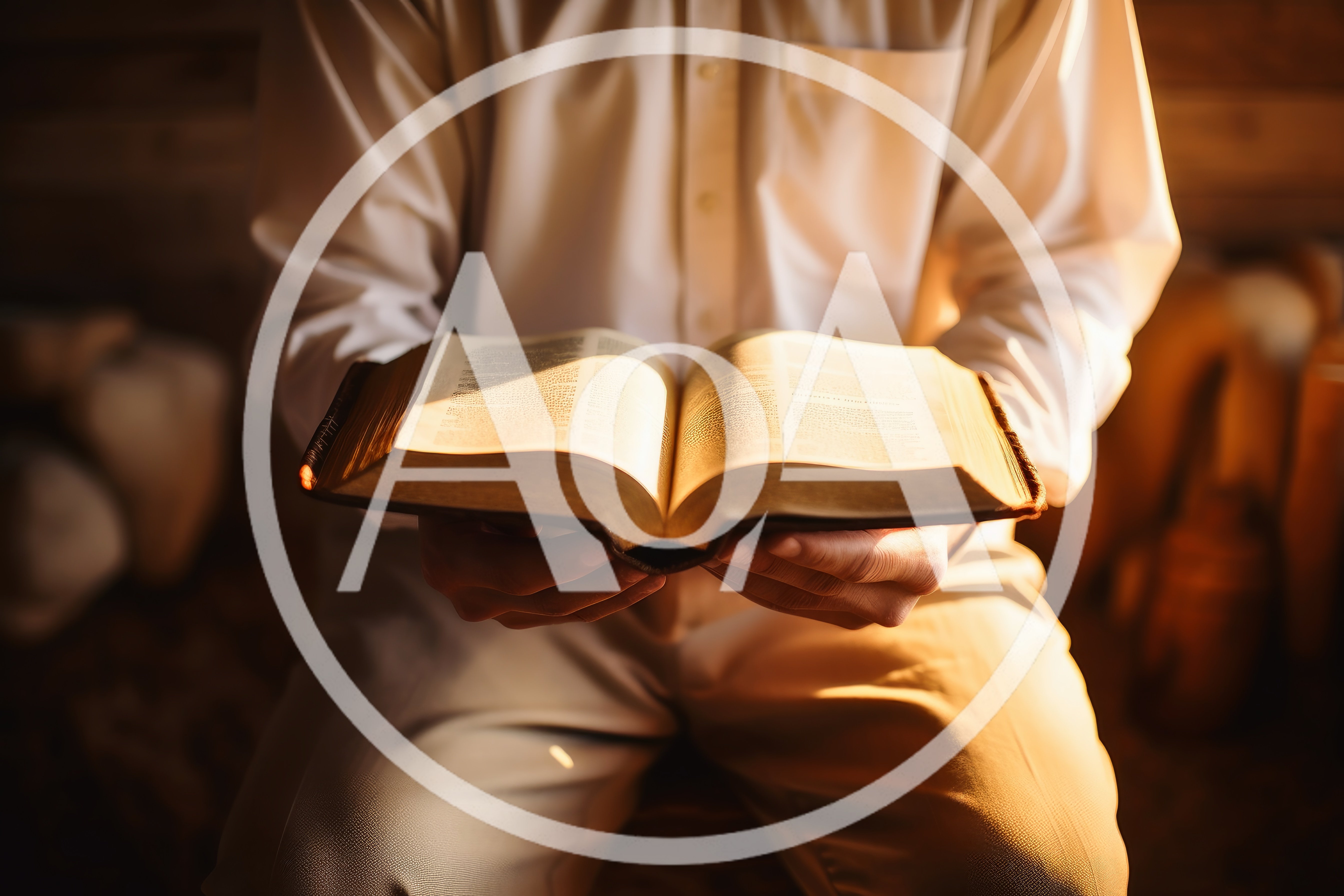 Person Holding An Open Bible In Warm Light