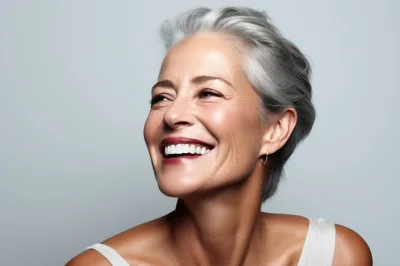 Portrait Of A Smiling Mature Woman With Gray Hair