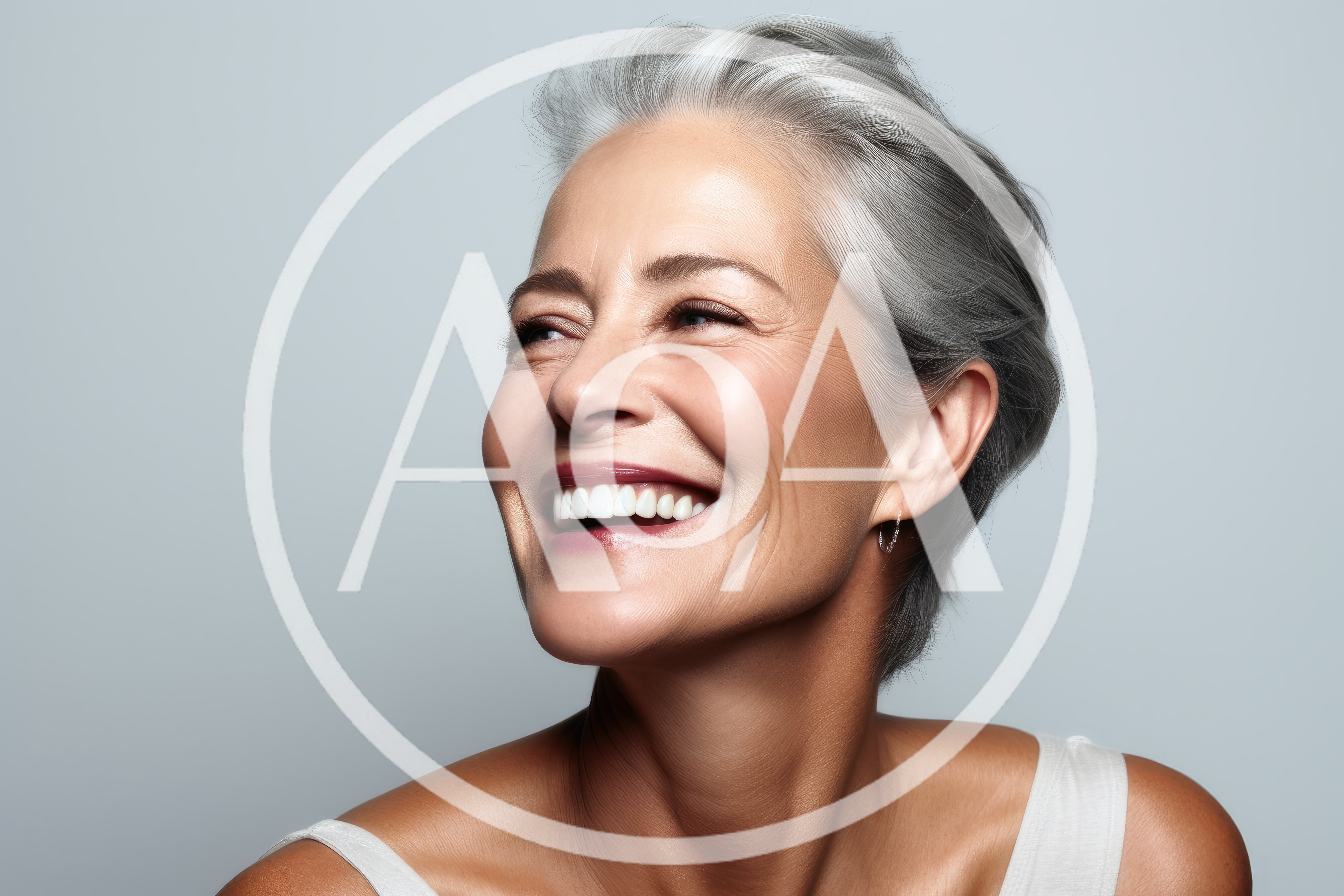 Portrait Of A Smiling Mature Woman With Gray Hair