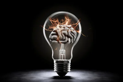 Human Brain Inside A Glowing Light Bulb