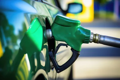 Green Fuel Nozzle Refueling A Green Car