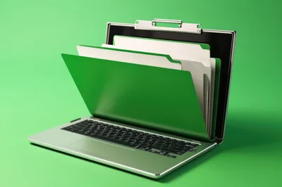 Laptop Computer Merged With A Green Office File Folder