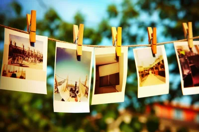 Polaroid Photos Hanging on a Clothesline Outdoors