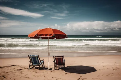 Two Empty Beach Chairs Under A Red Umbrella