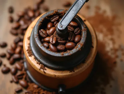 Manual Coffee Grinder Filled With Roasted Coffee Beans