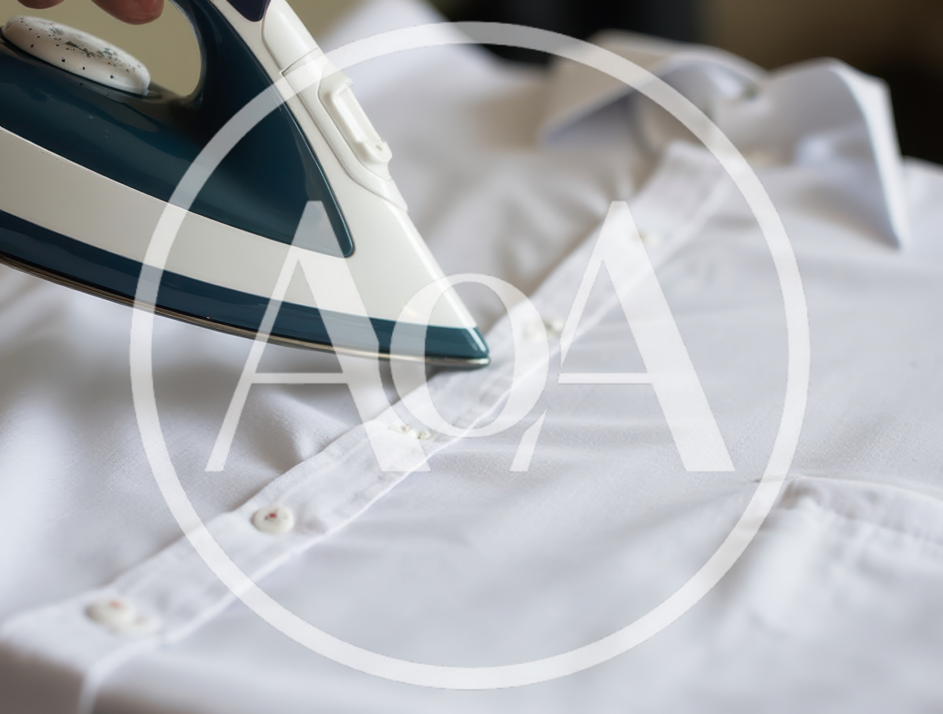 Person Ironing A Crisp White Dress Shirt