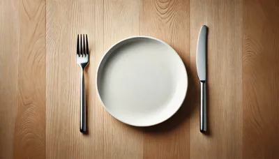 Empty White Plate With Fork And Knife On Wood