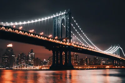 Manhattan Bridge Illuminated At Night Over East River